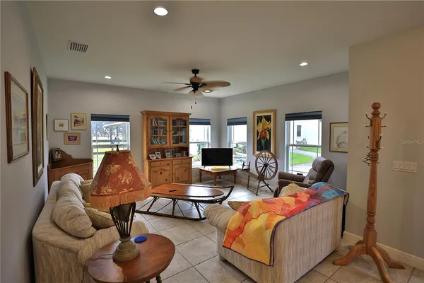 a kitchen with stainless steel appliances granite countertop a sink refrigerator and cabinets