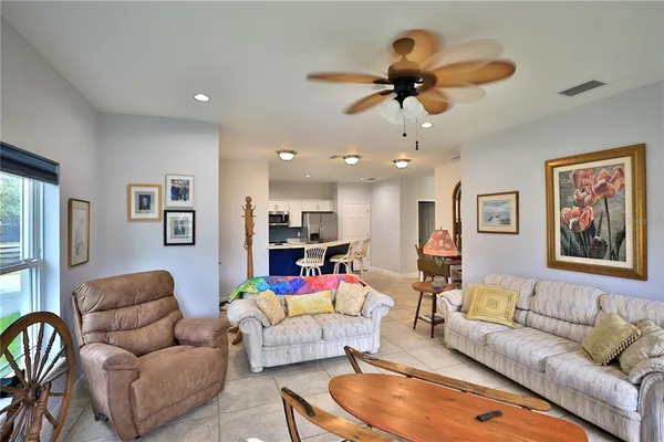 a bathroom with a granite countertop double vanity sink and a mirror