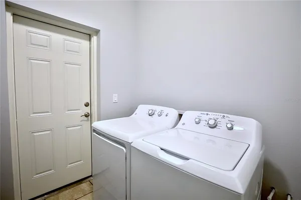 a front view of house with yard and trees