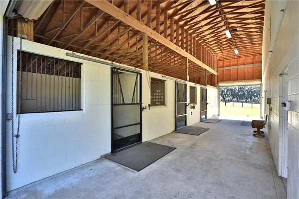 a kitchen with a refrigerator a sink and dishwasher with wooden floor