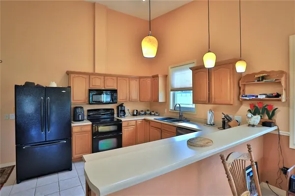 a living room with fireplace furniture and a flat screen tv
