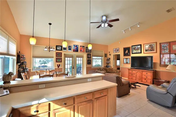 a kitchen with a sink cabinets and wooden floor