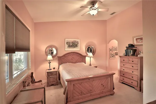 a bathroom with a granite countertop shower and a toilet