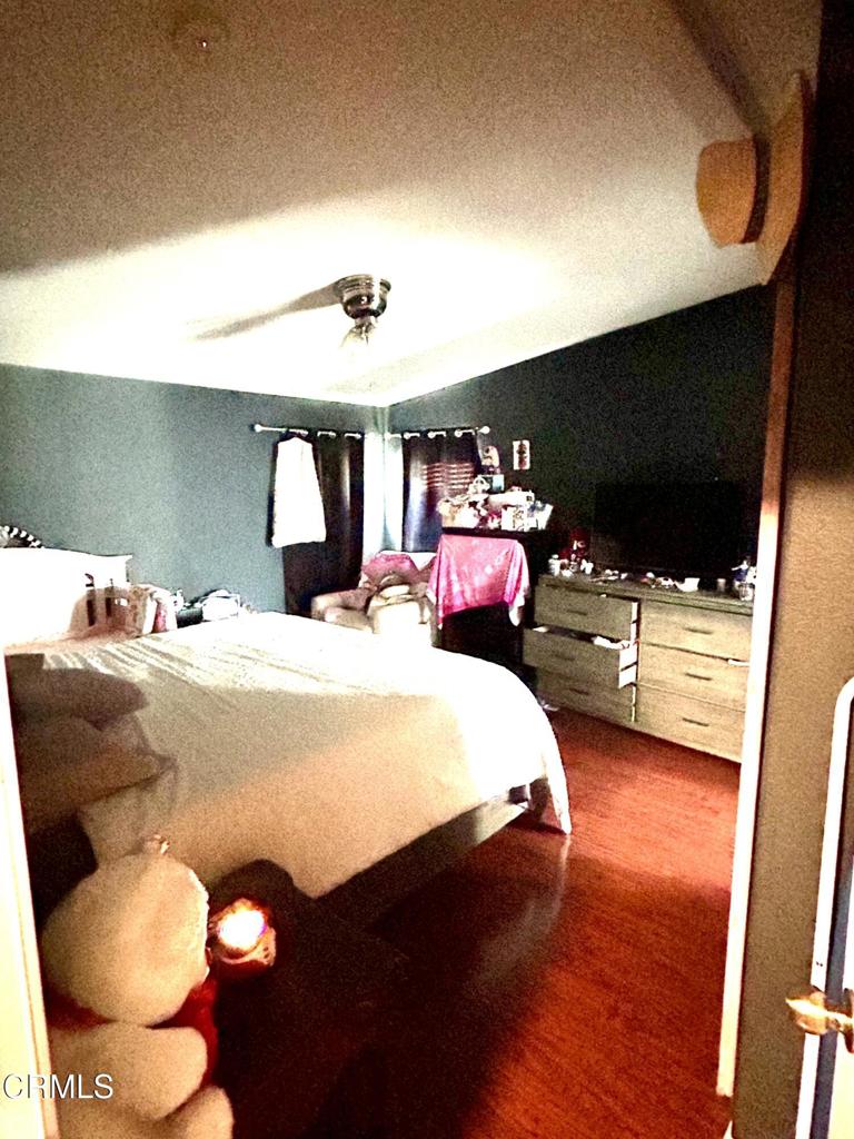 2400 East Pleasant Valley Road, Unit 108 Oxnard, CA 93033 - Photo 13 of 19 a bed room with a bed and a chair