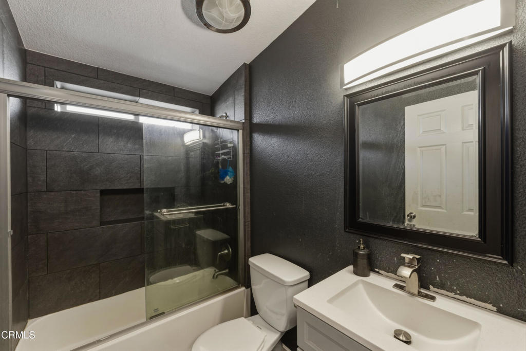 2400 East Pleasant Valley Road, Unit 108 Oxnard, CA 93033 - Photo 15 of 29 a bathroom with a sink toilet and shower