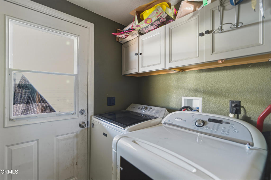 2400 East Pleasant Valley Road, Unit 108 Oxnard, CA 93033 - Photo 18 of 29 a utility room with dryer and washer