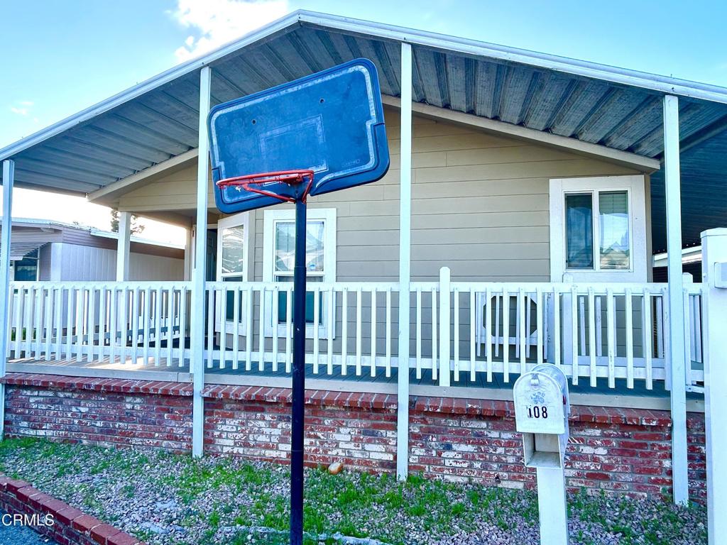 2400 East Pleasant Valley Road, Unit 108 Oxnard, CA 93033 - Photo 2 of 19 a house view with a garden space
