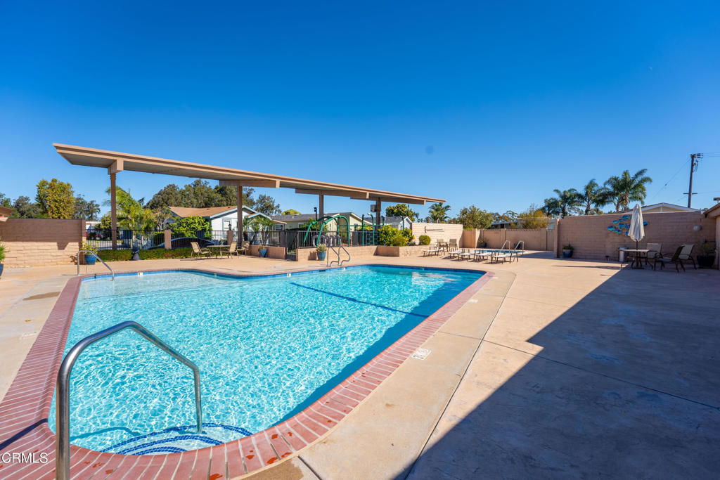 2400 East Pleasant Valley Road, Unit 108 Oxnard, CA 93033 - Photo 29 of 29 swimming pool view with a garden space