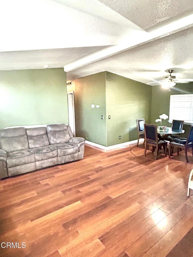 2400 East Pleasant Valley Road, Unit 108 Oxnard, CA 93033 - Photo 3 of 19 a view of a livingroom with furniture and window