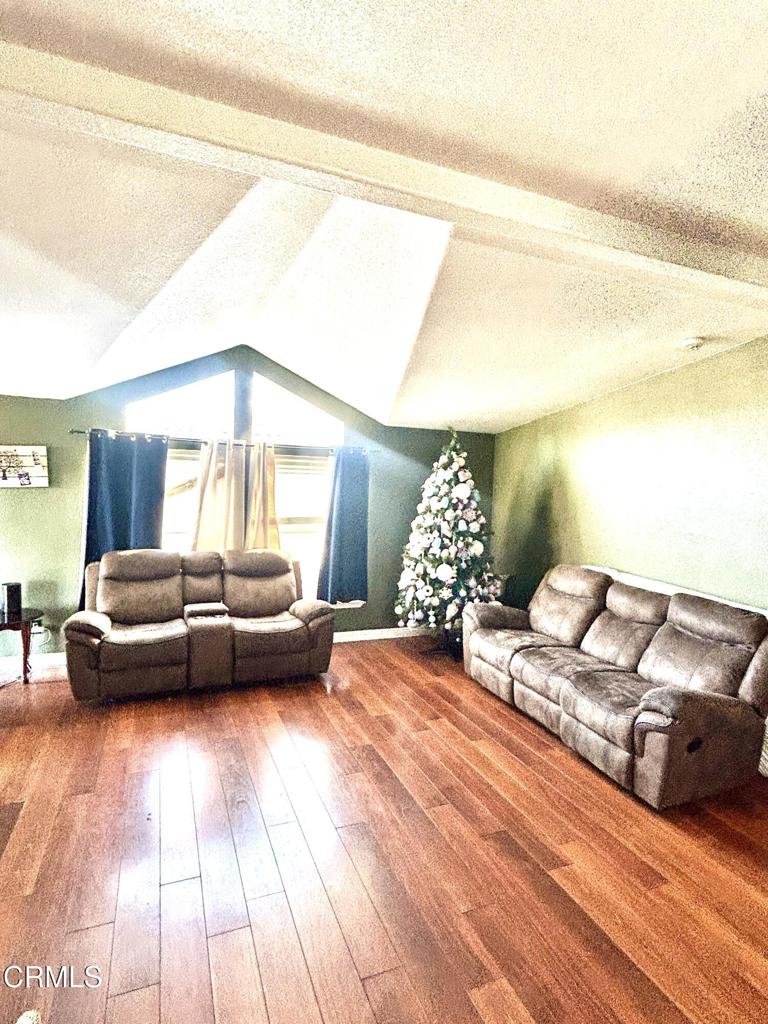 2400 East Pleasant Valley Road, Unit 108 Oxnard, CA 93033 - Photo 5 of 19 a bedroom with a bed and a night stand