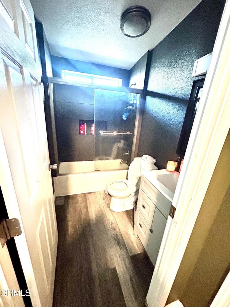 2400 East Pleasant Valley Road, Unit 108 Oxnard, CA 93033 - Photo 10 of 19 a view of a hardwood & door