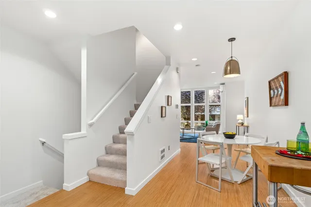 a bedroom with a large bed and a chair