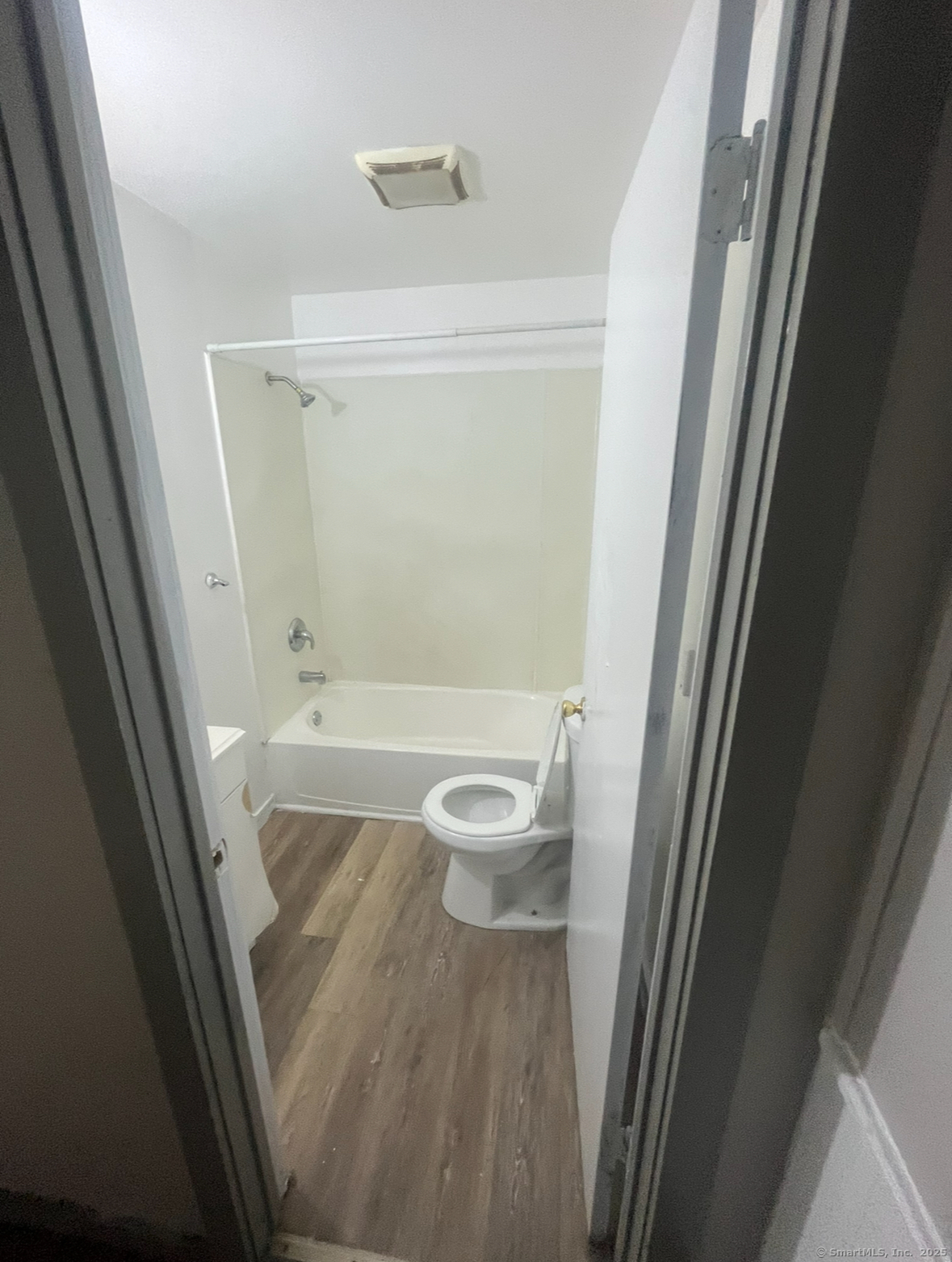 237 Park Street Bridgeport, CT 06608 - Photo 2 of 5 a bathroom with a granite countertop shower and a sink