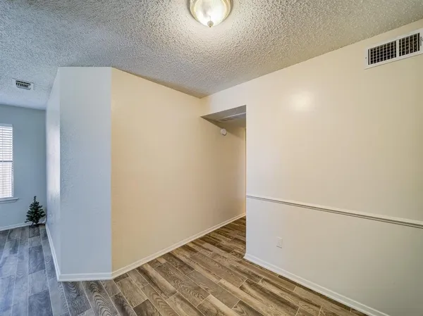 a view of small space with wooden floor