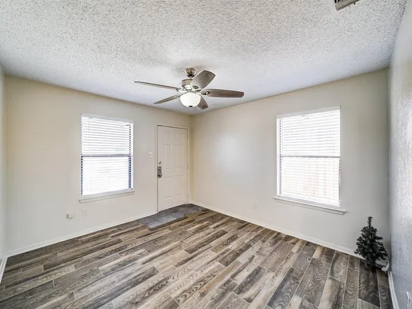 a view of an empty room with a window