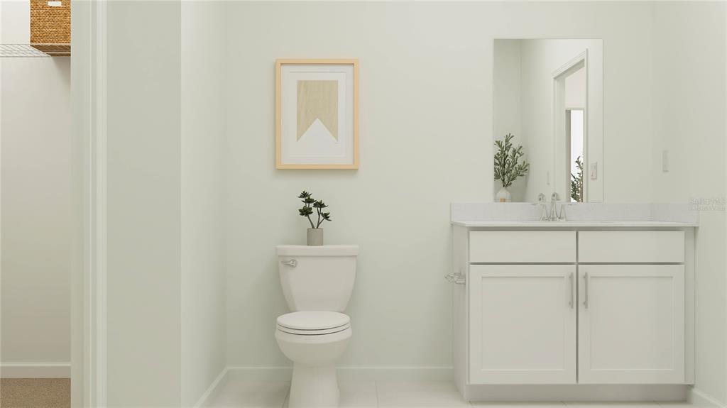 4244 St Thomas Way Kissimmee, FL 34758 - Photo 16 of 30 a bathroom with a toilet a sink and mirror