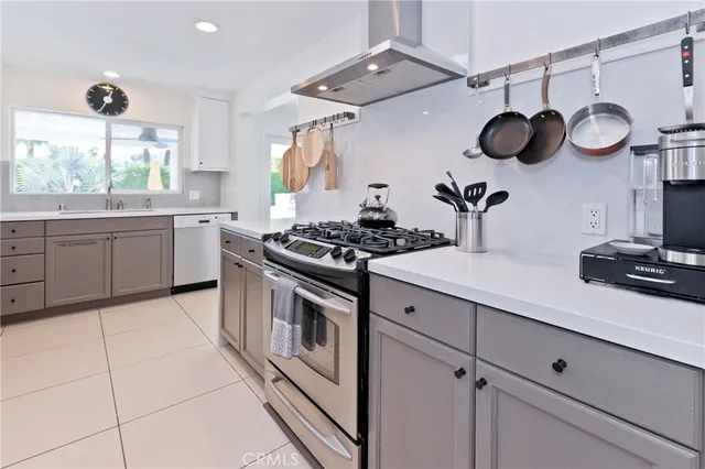 a spacious bedroom with two beds and a large window