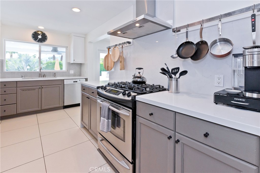 1057 East Marshall Way Palm Springs, CA 92262 - Photo 14 of 64 a kitchen with appliances cabinets and a window