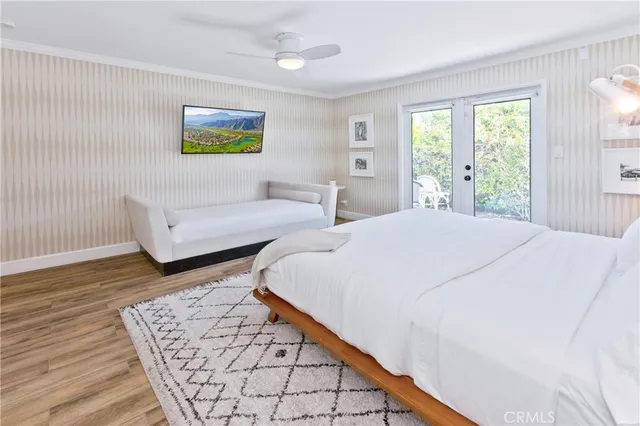 a bathroom with a tub a sink double vanity and a mirror