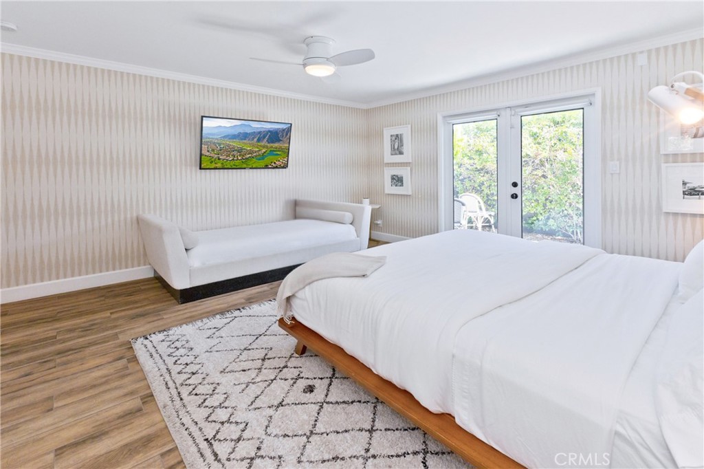 1057 East Marshall Way Palm Springs, CA 92262 - Photo 15 of 64 a spacious bedroom with two beds and a large window