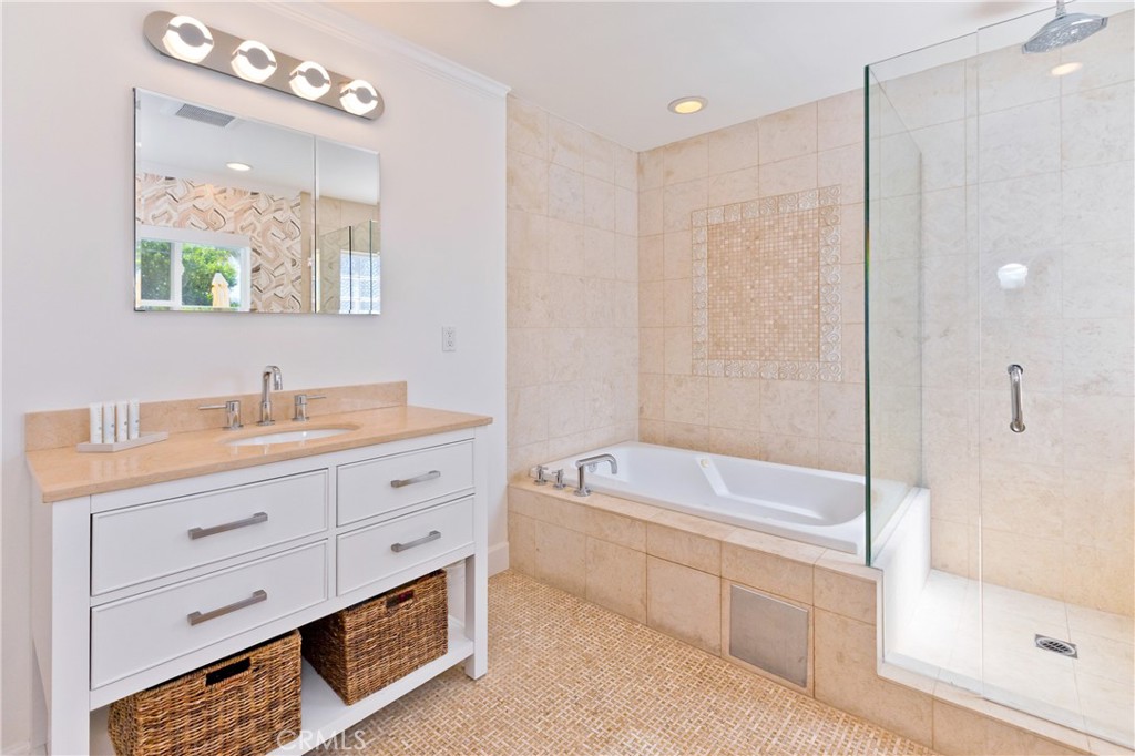 1057 East Marshall Way Palm Springs, CA 92262 - Photo 16 of 64 a bathroom with a tub a sink double vanity and a mirror