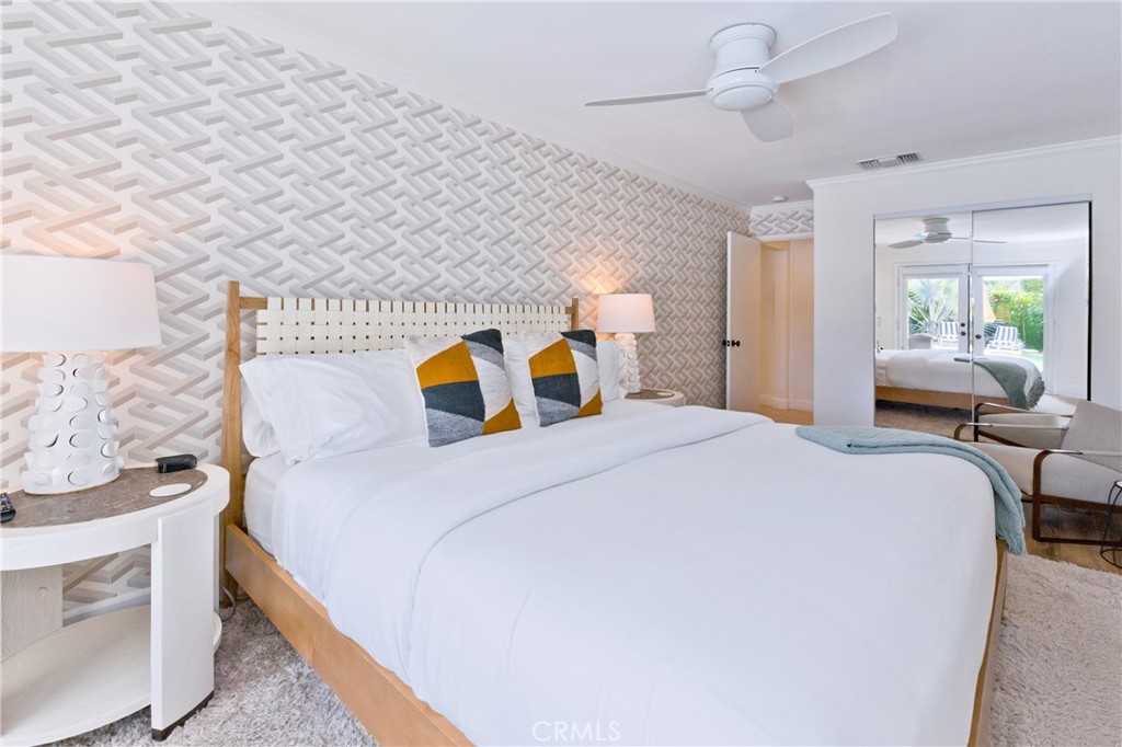 1057 East Marshall Way Palm Springs, CA 92262 - Photo 18 of 64 a bedroom with a bed and dresser