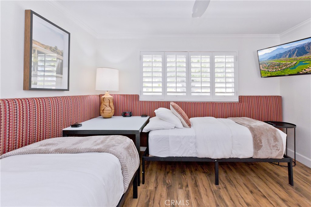 1057 East Marshall Way Palm Springs, CA 92262 - Photo 25 of 64 a bedroom with bed and a window
