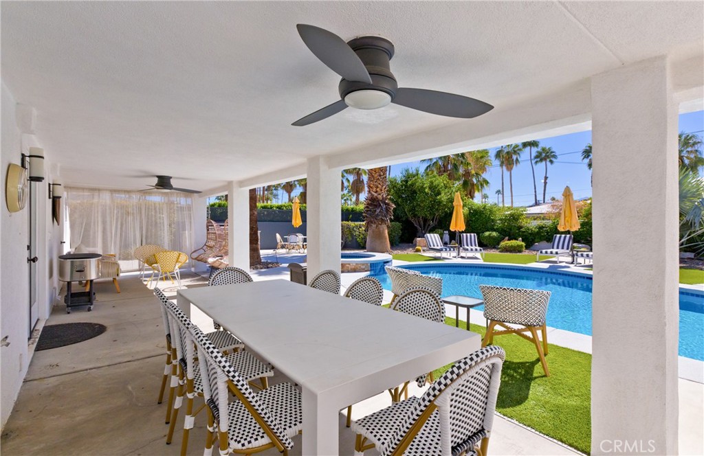 1057 East Marshall Way Palm Springs, CA 92262 - Photo 31 of 64 a view of a dining room with furniture window and outside view