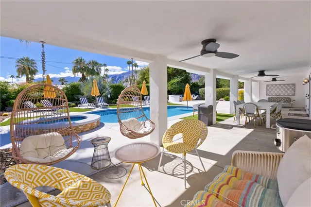 a balcony with table and chairs