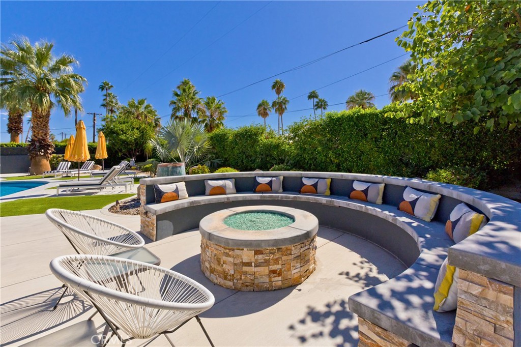 1057 East Marshall Way Palm Springs, CA 92262 - Photo 38 of 64 a view of a swimming pool with a patio