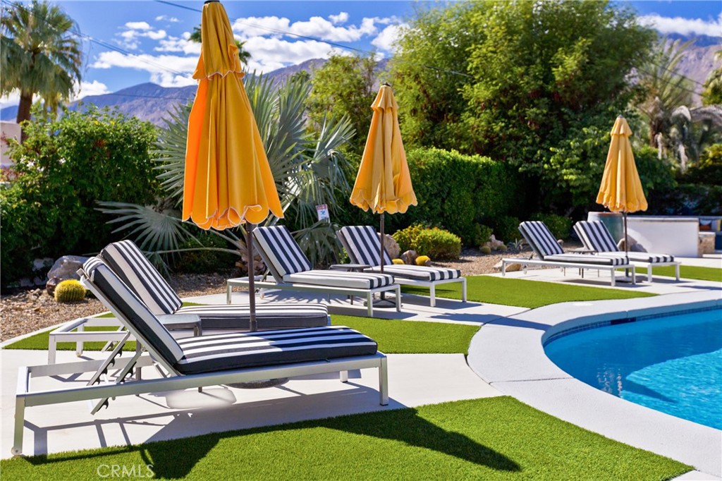 1057 East Marshall Way Palm Springs, CA 92262 - Photo 40 of 64 a view of swimming pool with sitting area and slide