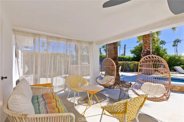 a view of a dining room with furniture window and outside view