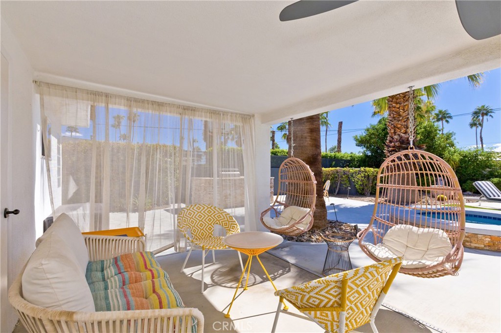 1057 East Marshall Way Palm Springs, CA 92262 - Photo 4 of 64 a view of a dining room with furniture window and outside view
