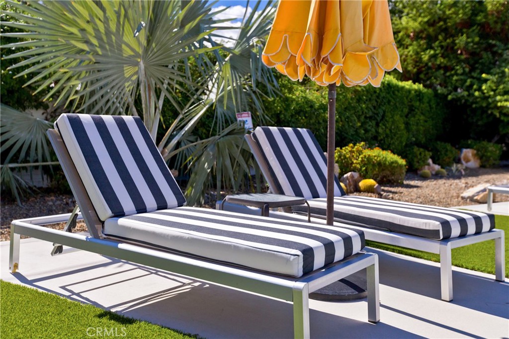 1057 East Marshall Way Palm Springs, CA 92262 - Photo 41 of 64 a view of balcony with two chairs and a potted plant