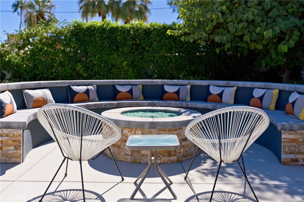 1057 East Marshall Way Palm Springs, CA 92262 - Photo 42 of 64 a balcony with table and chairs