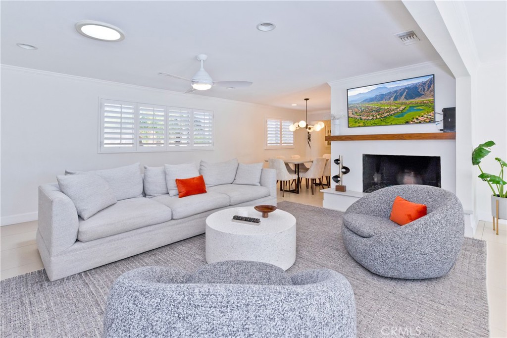 1057 East Marshall Way Palm Springs, CA 92262 - Photo 43 of 64 a living room with furniture and a fireplace
