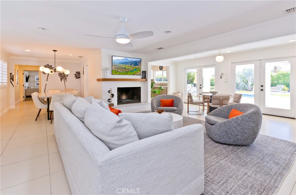 1057 East Marshall Way Palm Springs, CA 92262 - Photo 44 of 64 a living room with furniture and a fireplace