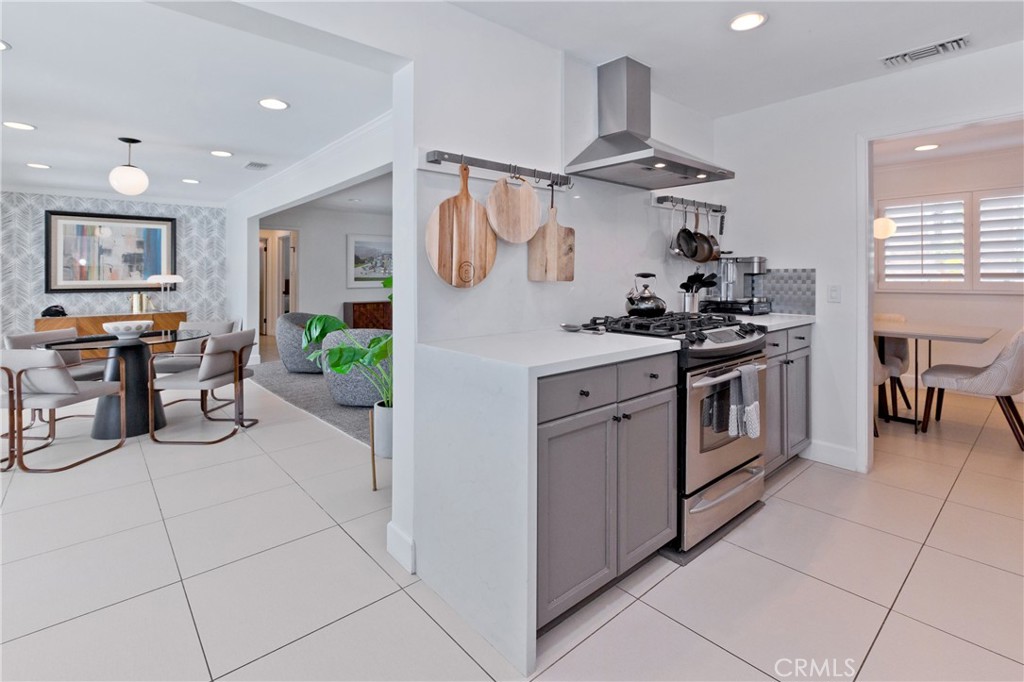 1057 East Marshall Way Palm Springs, CA 92262 - Photo 48 of 64 a kitchen with stainless steel appliances granite countertop a stove and a sink