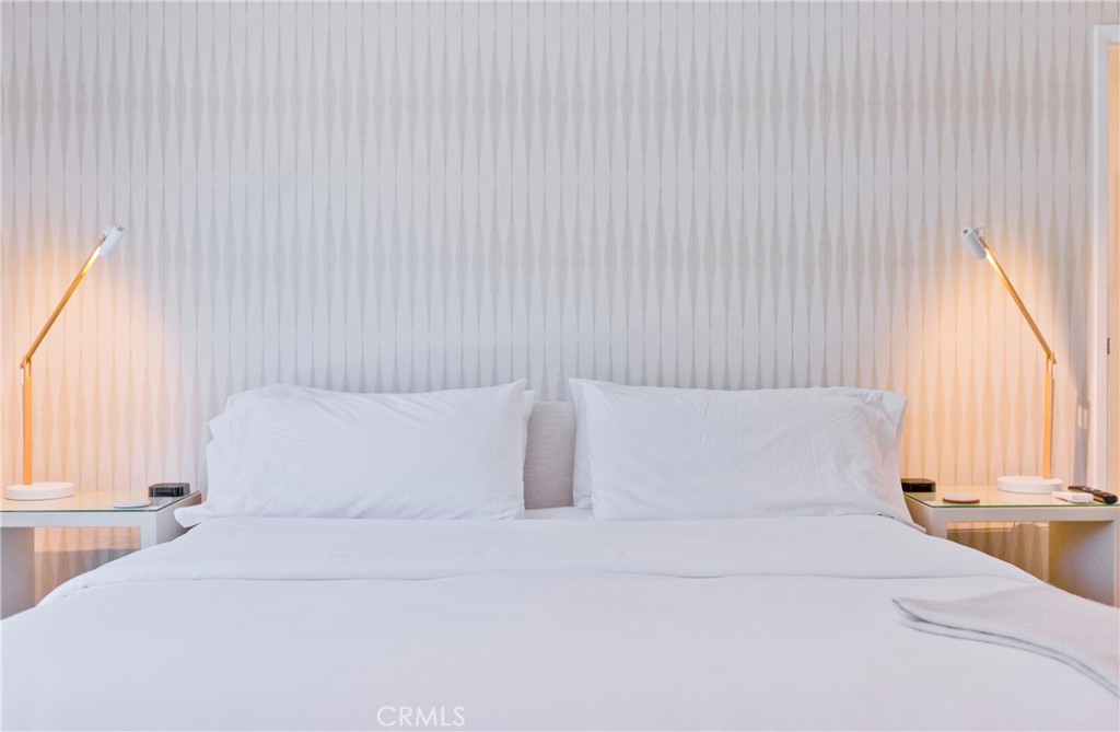 1057 East Marshall Way Palm Springs, CA 92262 - Photo 49 of 64 a bedroom with a large bed and a large window