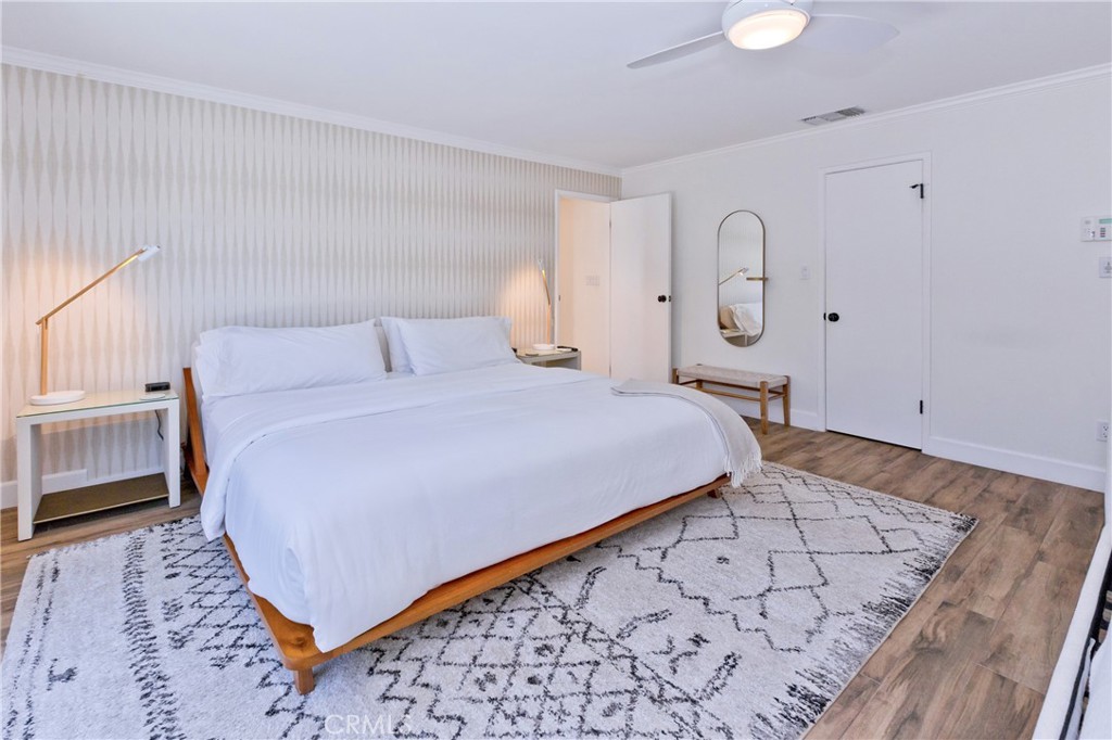 1057 East Marshall Way Palm Springs, CA 92262 - Photo 50 of 64 a bedroom with a bed and a window