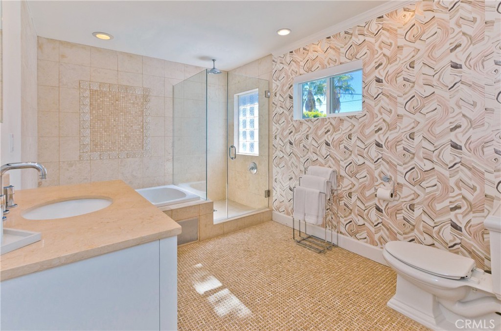 1057 East Marshall Way Palm Springs, CA 92262 - Photo 51 of 64 a spacious bathroom with a granite countertop sink a toilet and shower