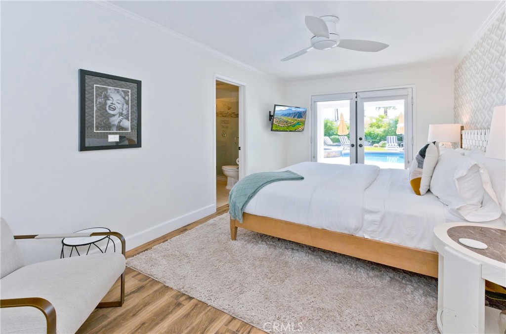 1057 East Marshall Way Palm Springs, CA 92262 - Photo 53 of 64 a bedroom with a bed and window