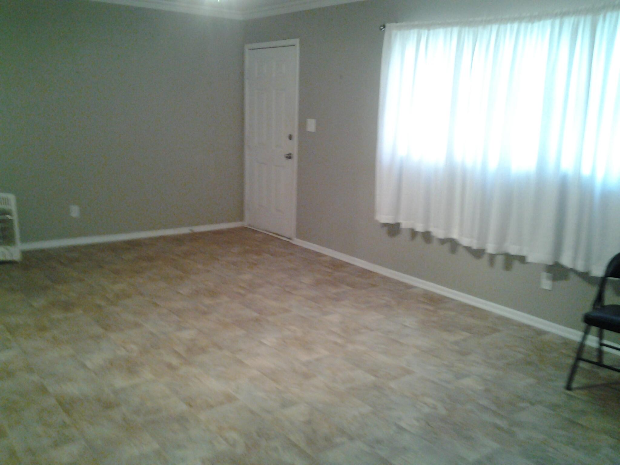 1404 South 9th Street Lamesa, TX 79331 - Photo 2 of 15 an empty room with windows