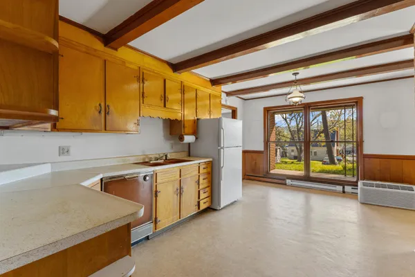a kitchen with stainless steel appliances granite countertop a sink and a stove