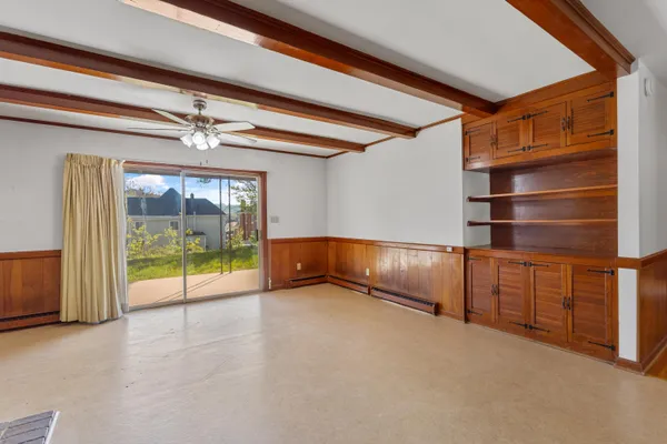 a view of an empty room with a fireplace