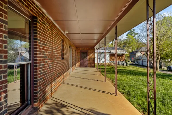a view of swimming pool with a patio