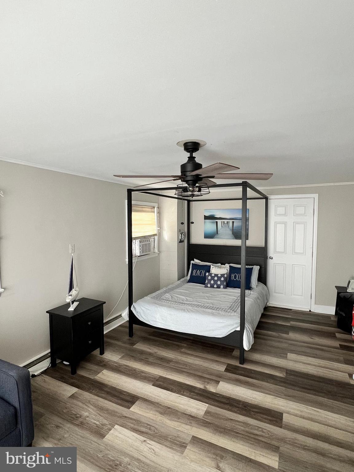 114 Hall Highway Crisfield, MD 21817 - Photo 11 of 30 a room with a bed and a table