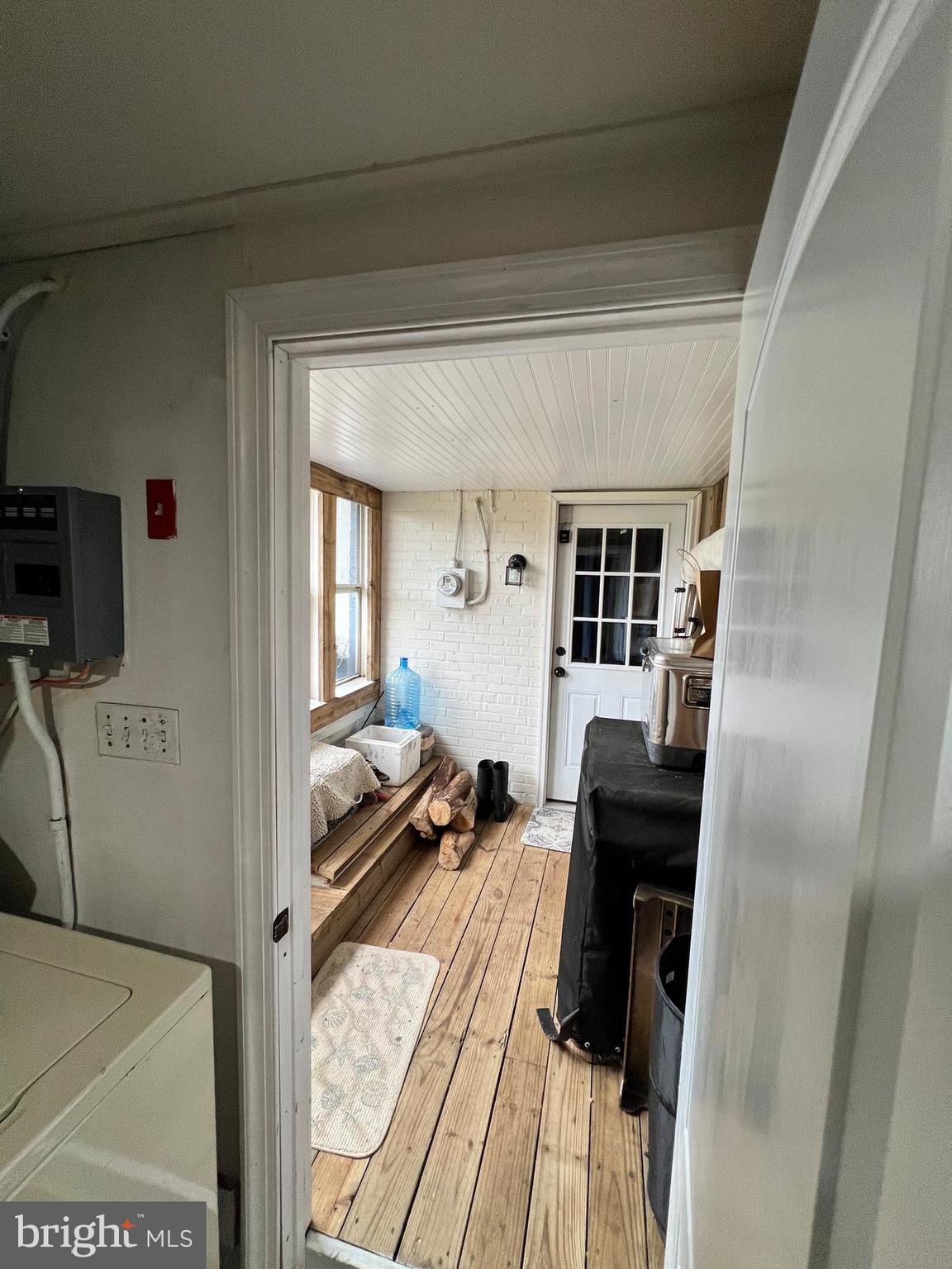 114 Hall Highway Crisfield, MD 21817 - Photo 13 of 30 a living room with furniture and a flat screen tv