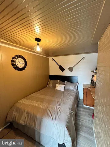 a bedroom with a bed and cabinets