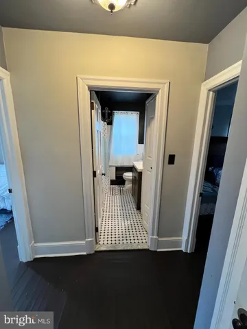 a view of a hardwood floor and staircase